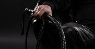 Dominant man with whip